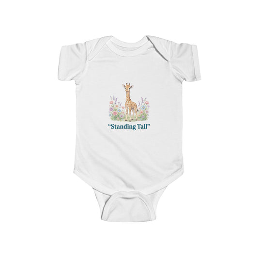 White baby onesie with a giraffe illustration and 'Standing Tall' text on a white background
