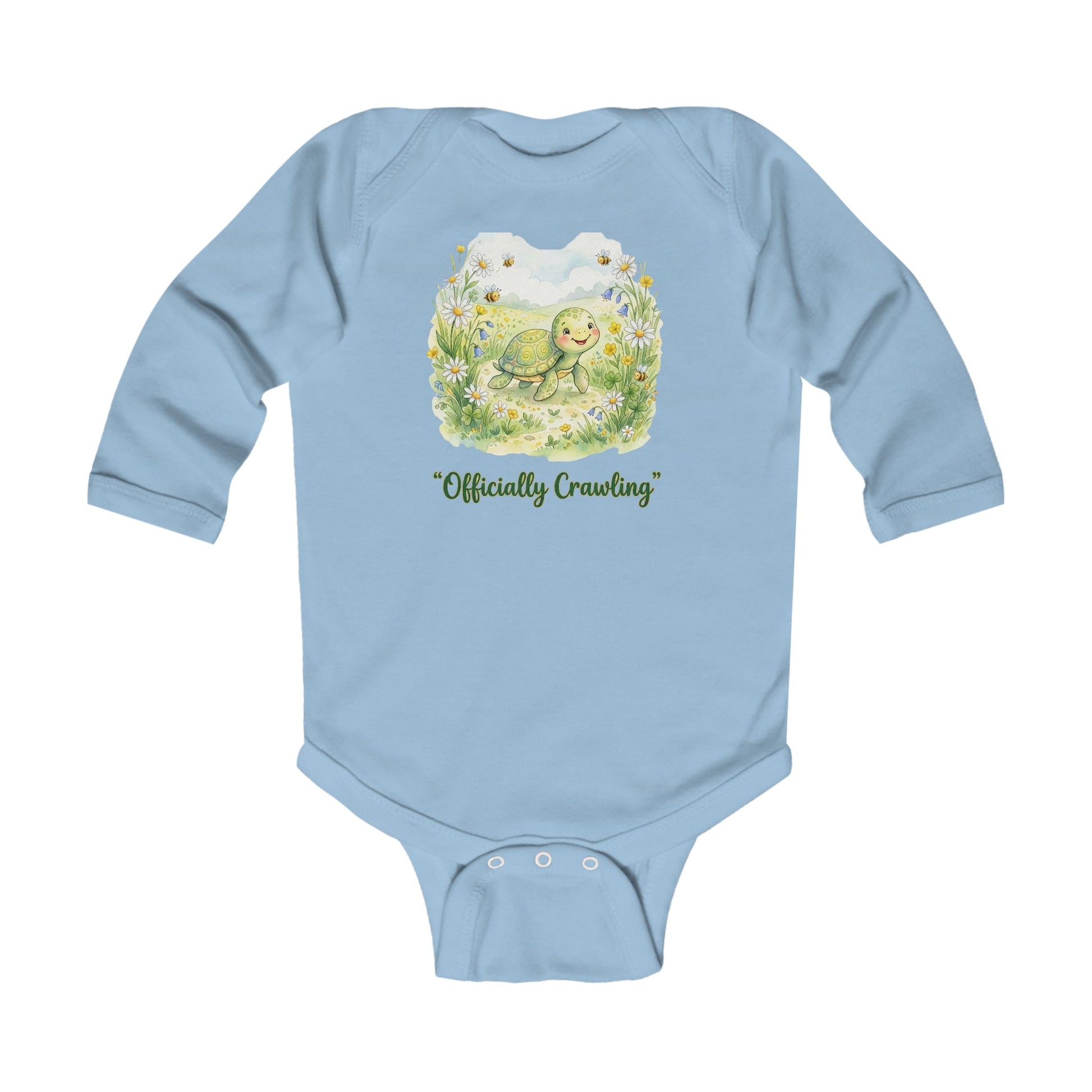 Light blue baby onesie with a turtle graphic and 'Officially Crawling' text on a white background